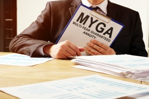 man holding folder for MYGA