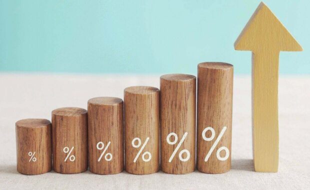 wooden blocks with percentage sign and arrow up