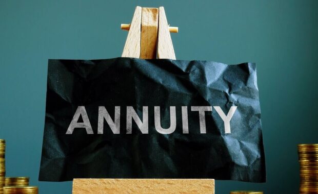 annuity sign on the black sheet ans coins