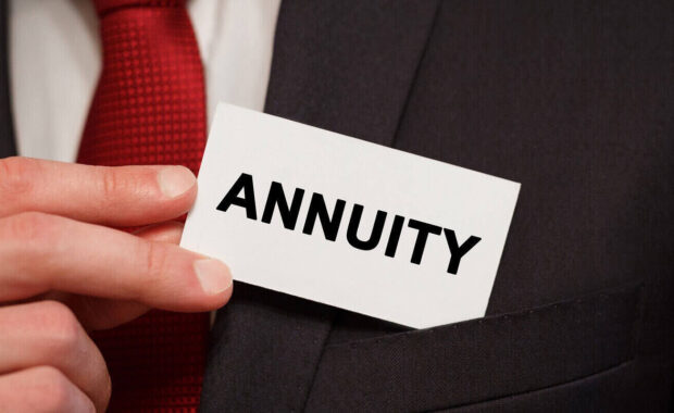 businessman putting a card with text annuity in the pocket