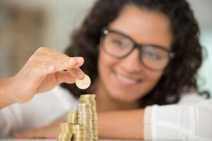 woman is saving coins