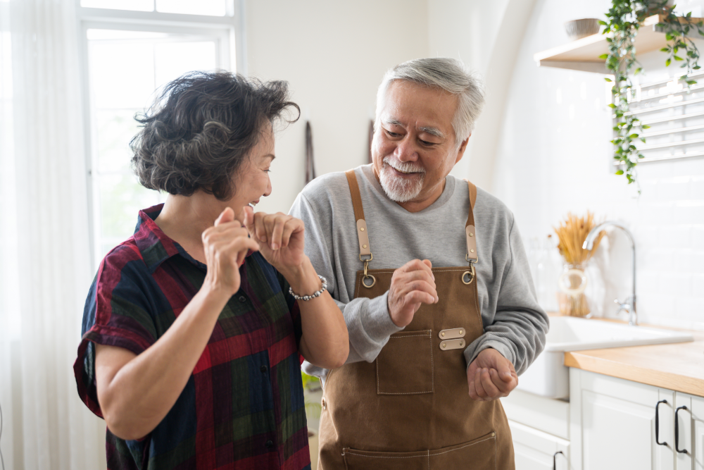 couple dancing in their kitchen together