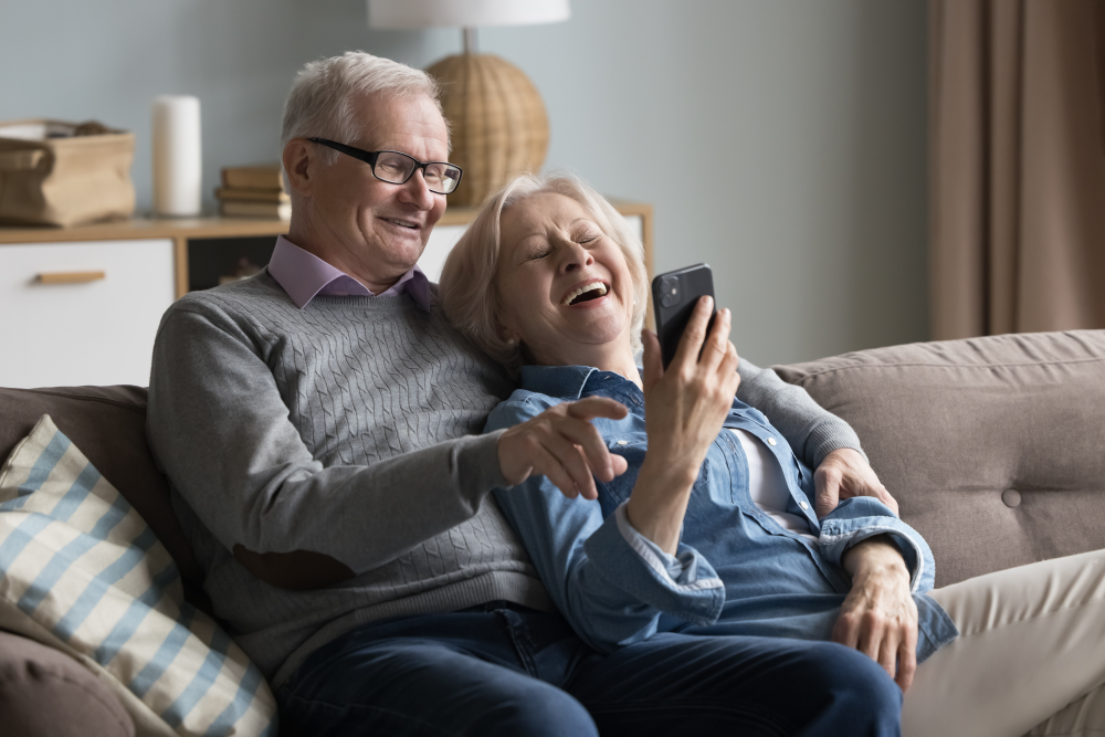 couple laughing on the couch together