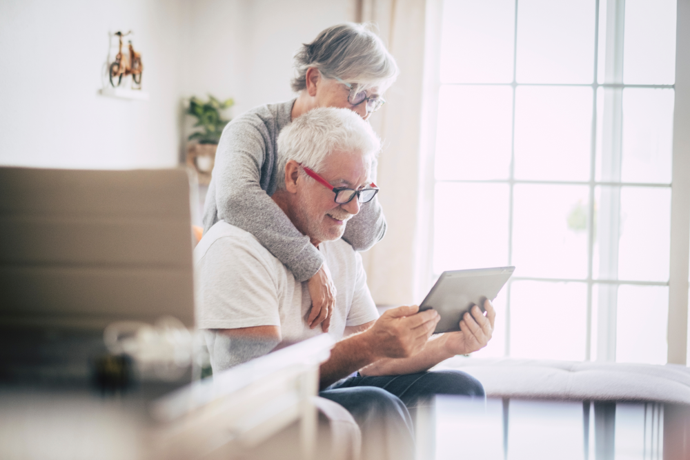 couple in their home looking up spia