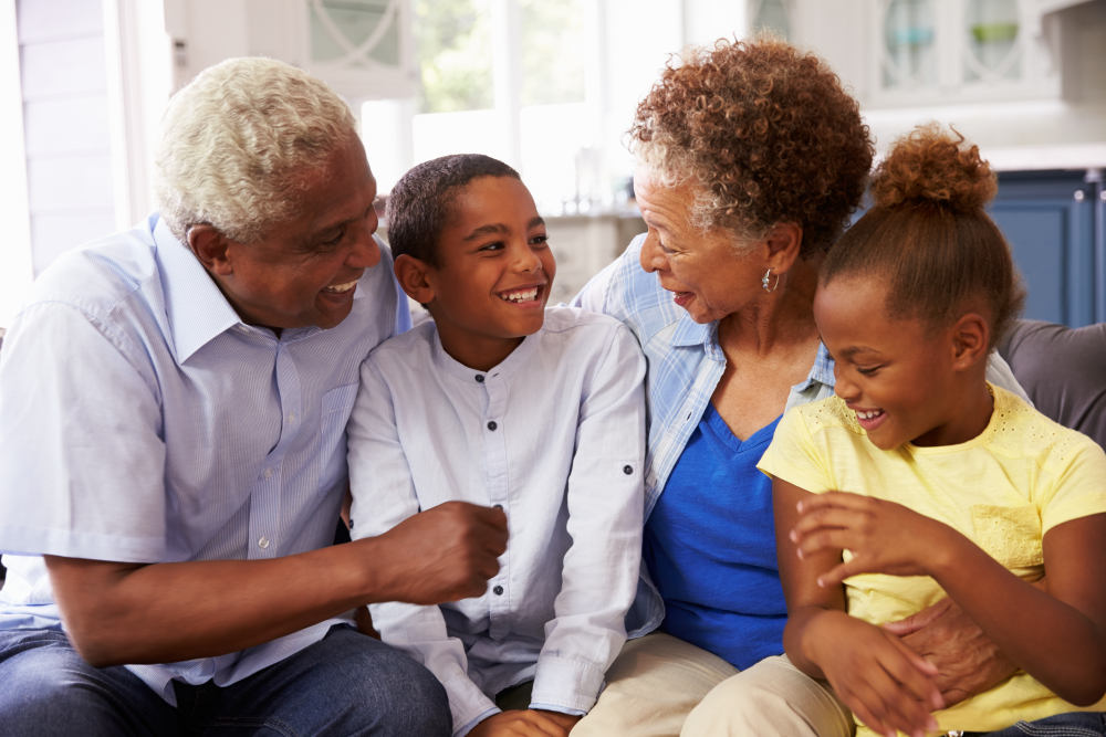 grandparents on couch with kids