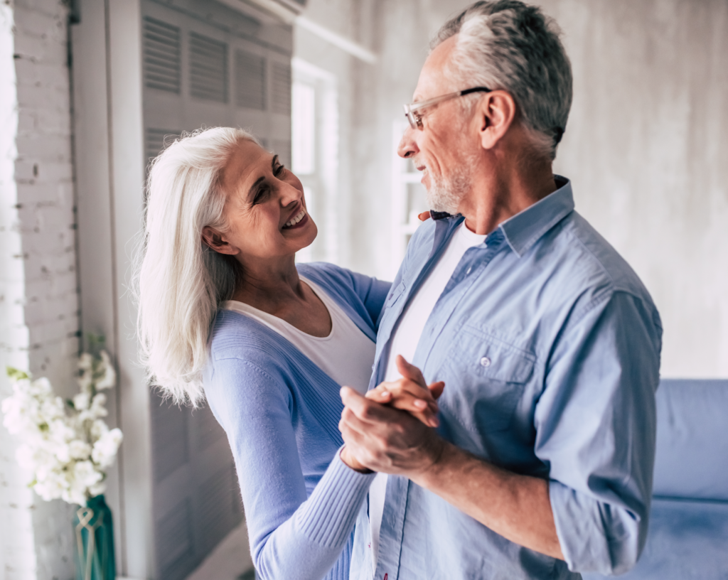 couple dancing in their living room