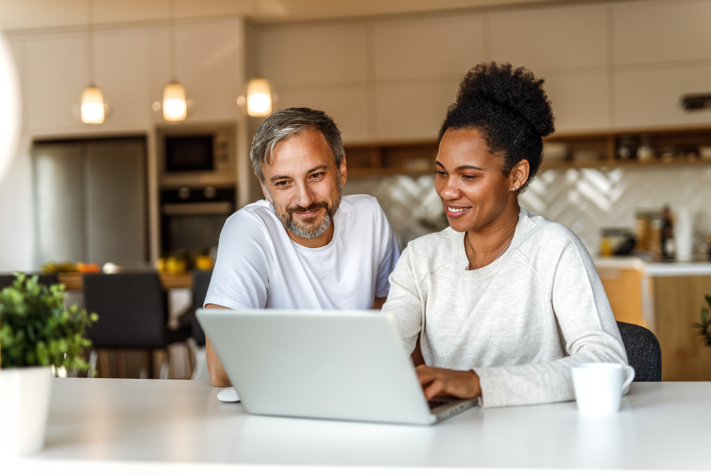 couple looking up annuities on their computer at home