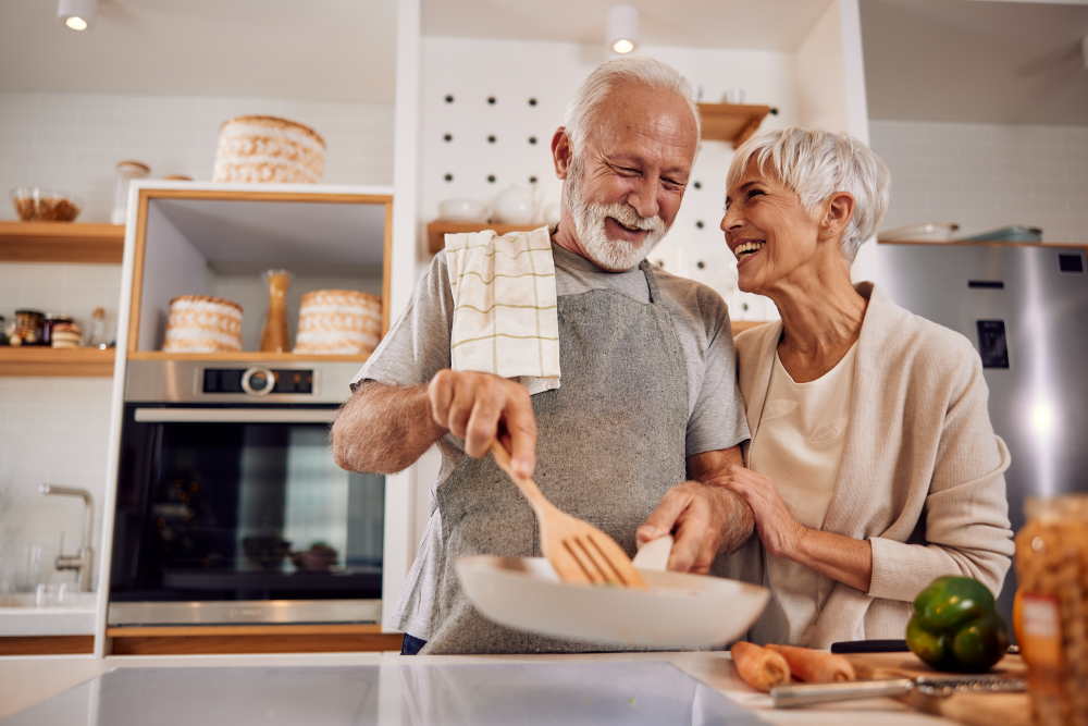 couple cooking together in their kitchen