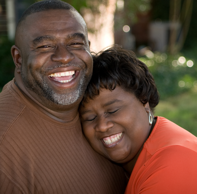 couple outside posing for a picture