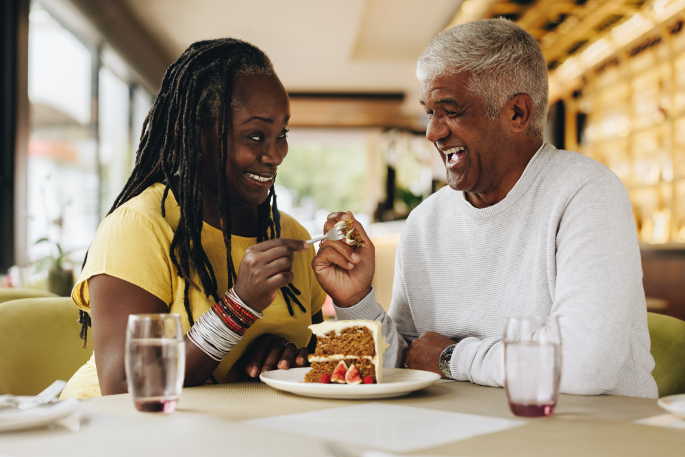 couple sharing a piece of cake at dinner