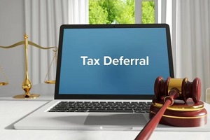 tax deferral on laptop screen with court gavel