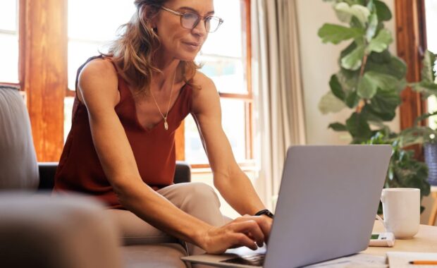 life insurance and senior woman on laptop for finance and investment planning during retirement at home